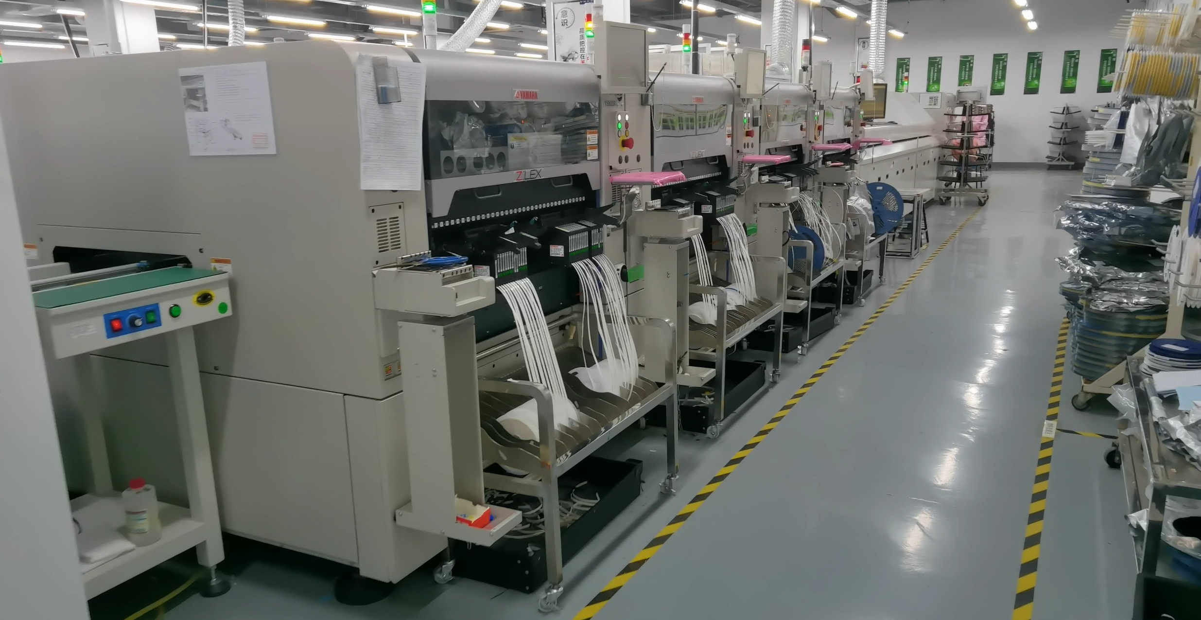 Integrated Yamaha SMT placement line installed inside cleanroom facility by Jinghe Technology for automated PCBA manufacturing