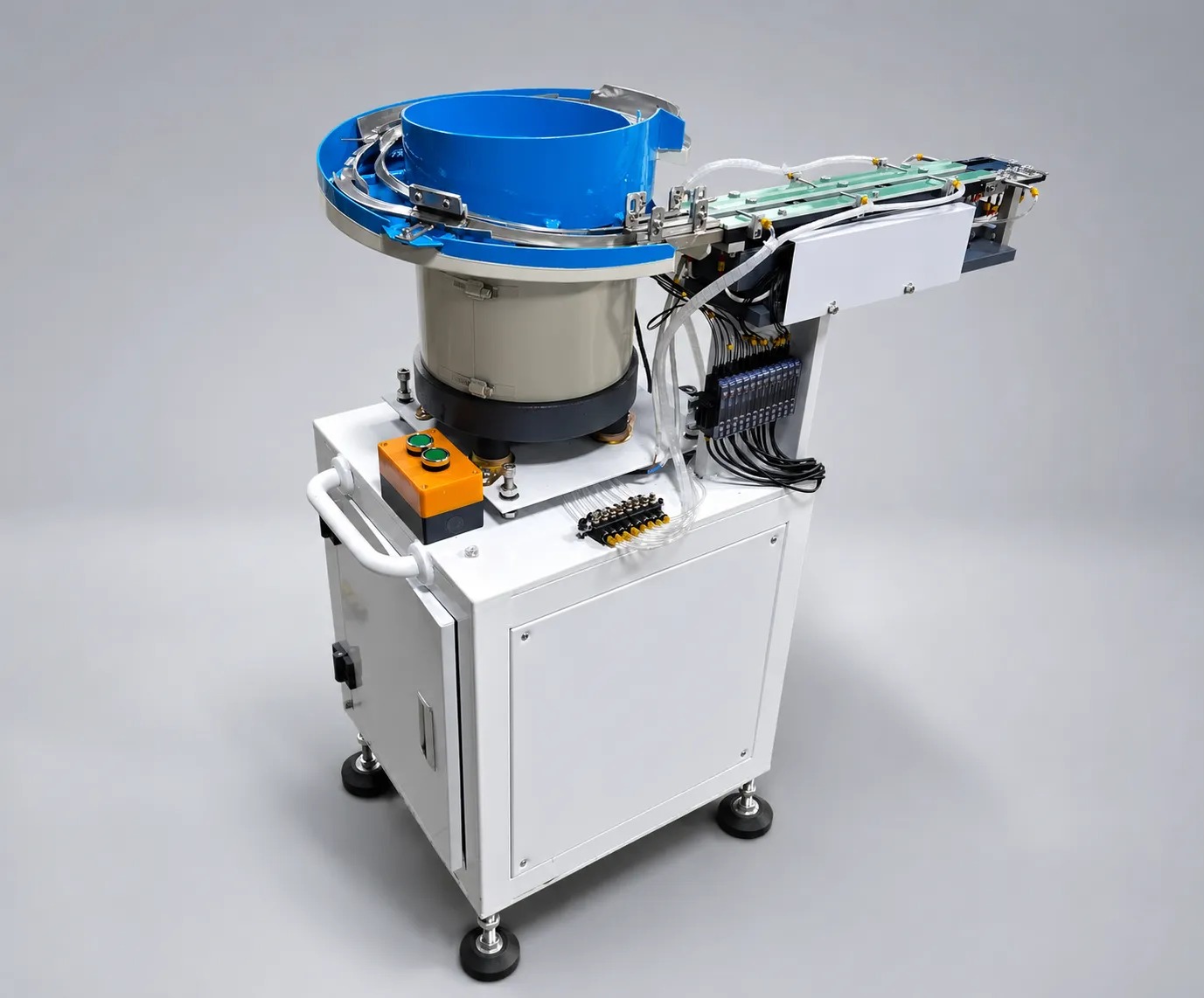JHIMS DPS-2 lens vibratory feeder: blue circular vibratory bowl on a white control cabinet with a linear track extending to the right