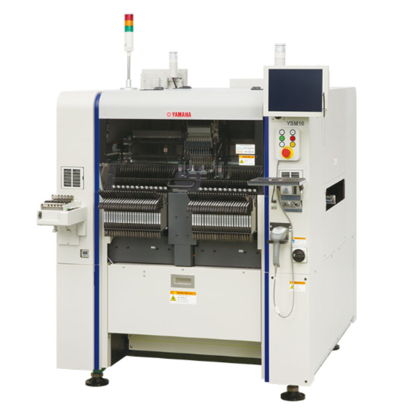 Yamaha YSM10 compact modular pick and place machine, front view with two tape-feeder banks loaded and the rotary head behind the center cover